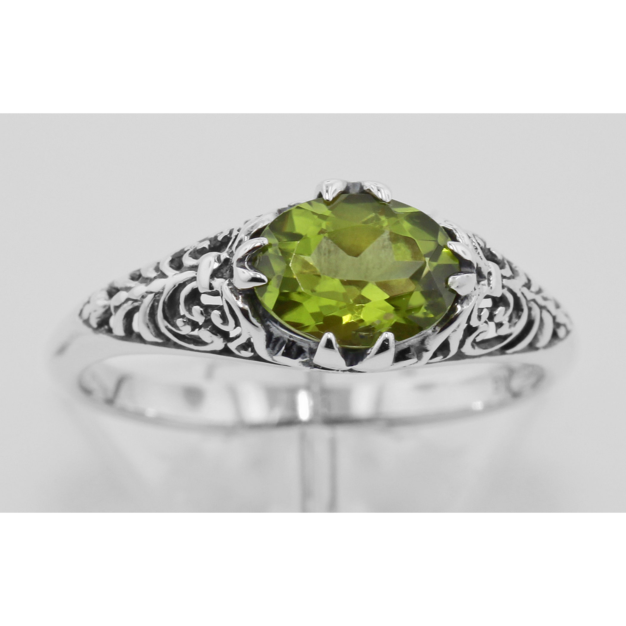 Detail view of Antique Style Natural Green Oval Peridot Filigree Ring highlighting Peridot