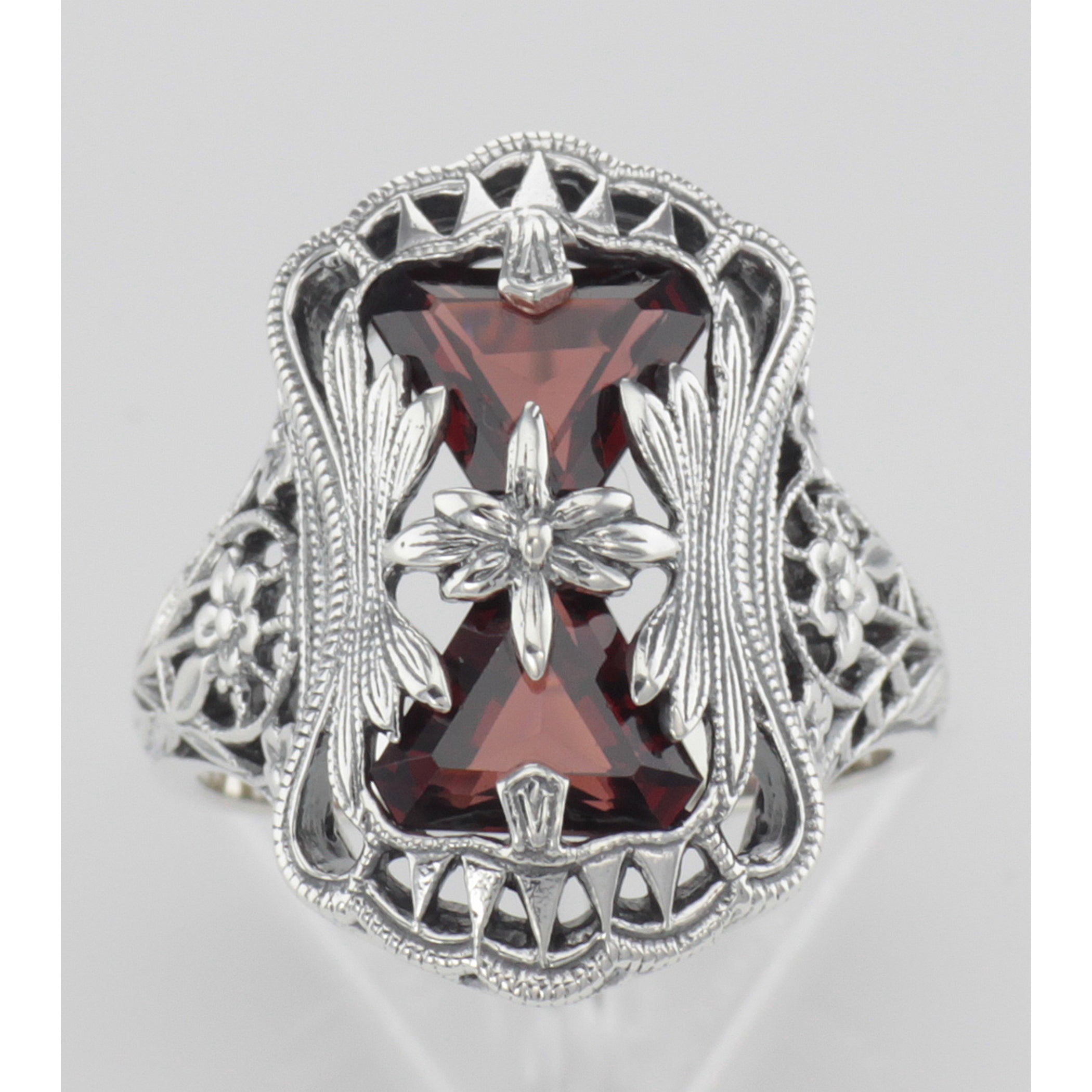 Detail view of Antique Style Garnet Filigree Ring with Flower Design highlighting Garnet