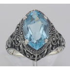 Detail view of Beautiful 3 Carat Victorian Style Blue Topaz Filigree Ring Sterling Silver highlighting Blue Topaz