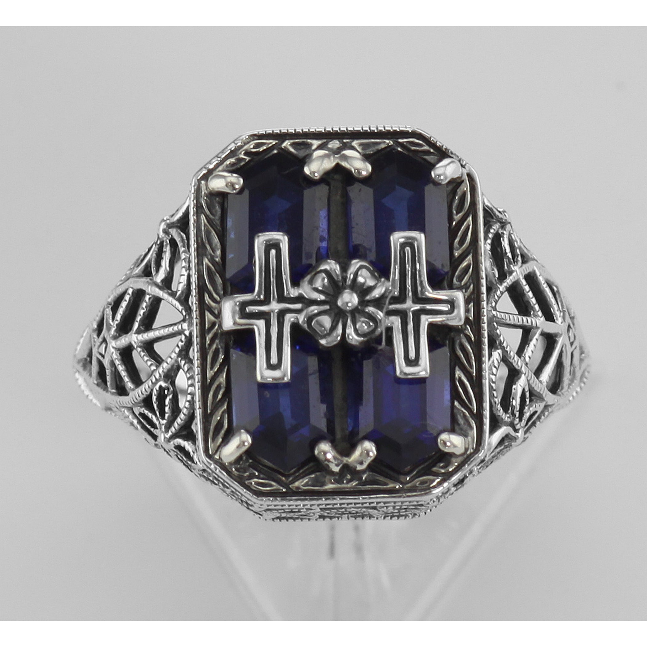 Detail view of Cross and Flower Design Blue Sapphire Filigree Ring highlighting Sapphire