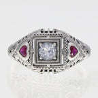 Detail view of Art Deco Style White Topaz Filigree Ring Red Ruby Accents Sterling Silver highlighting White Topaz, Ruby