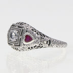 Back view of Art Deco Style White Topaz Filigree Ring Red Ruby Accents Sterling Silver showing 925 sterling silver hallmark