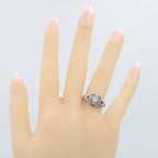 Detail view of Art Deco Style White Topaz Filigree Ring Red Ruby Accents Sterling Silver highlighting White Topaz, Ruby