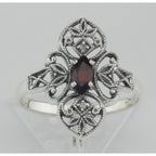 Detail view of Victorian Style Garnet Filigree Ring w/ Two Diamonds Sterling Silver highlighting Garnet, Diamond