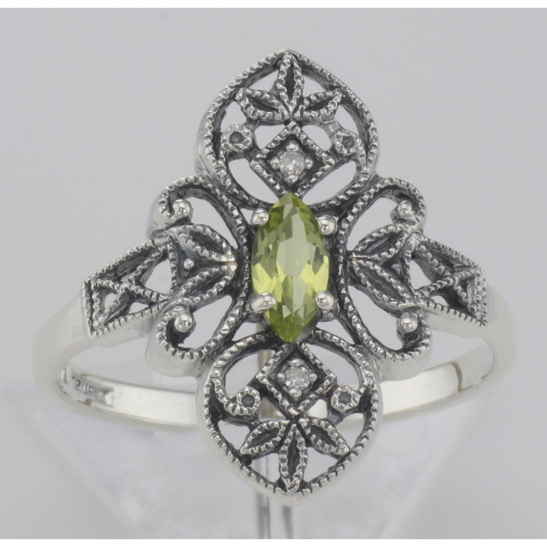 Detail view of Victorian Style Peridot Filigree Ring with Two Diamonds highlighting Diamond, Peridot