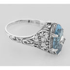 Back view of Blue Topaz Filigree Ring w/ Diamond showing 925 sterling silver hallmark