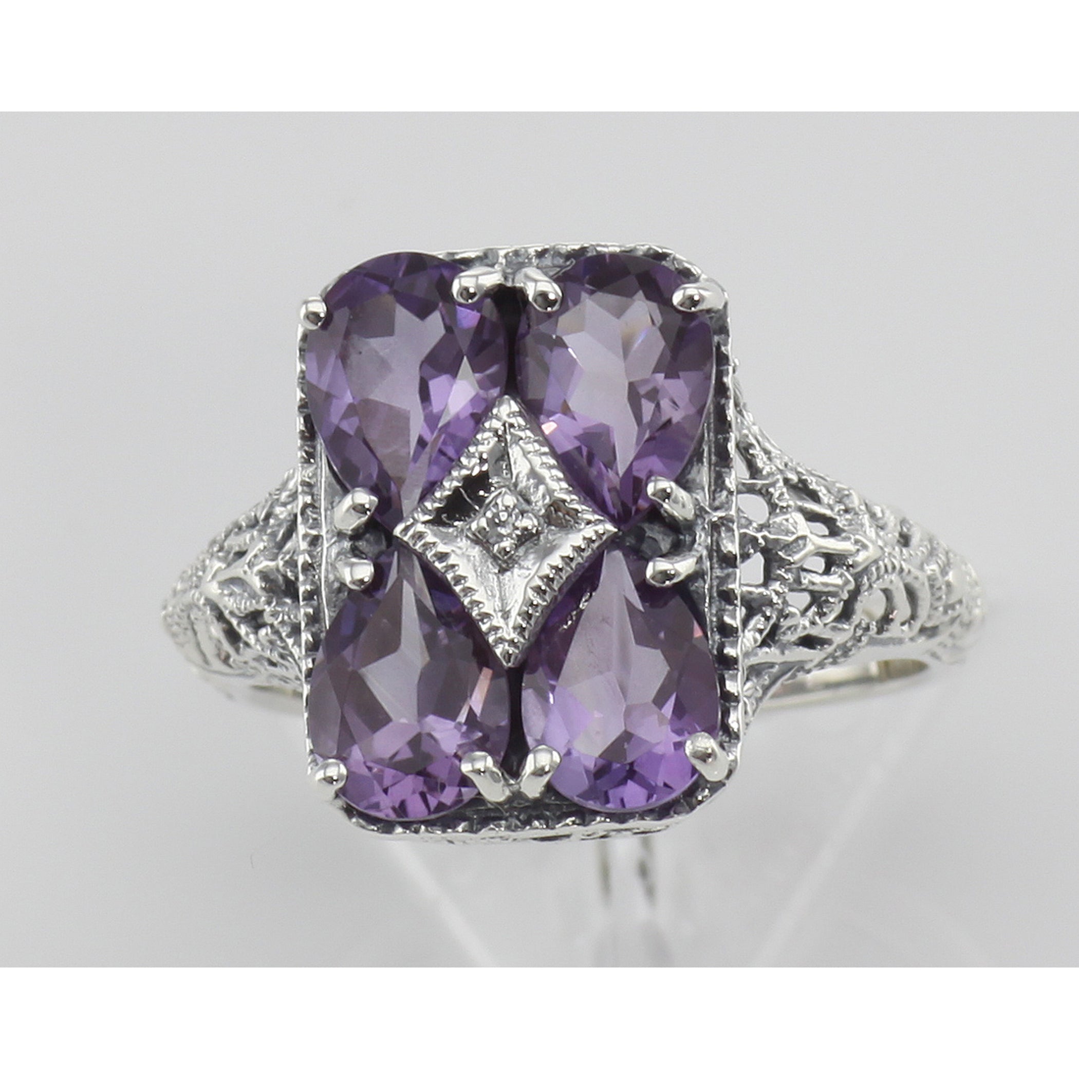 Detail view of Four Stone Amethyst Filigree Ring highlighting Amethyst