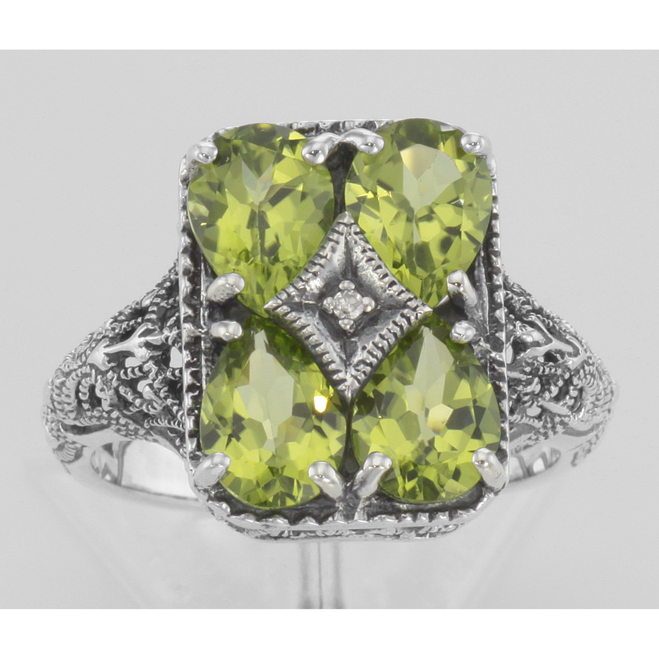 Detail view of Four Stone Genuine Peridot and Diamond Filigree Ring highlighting Diamond, Peridot