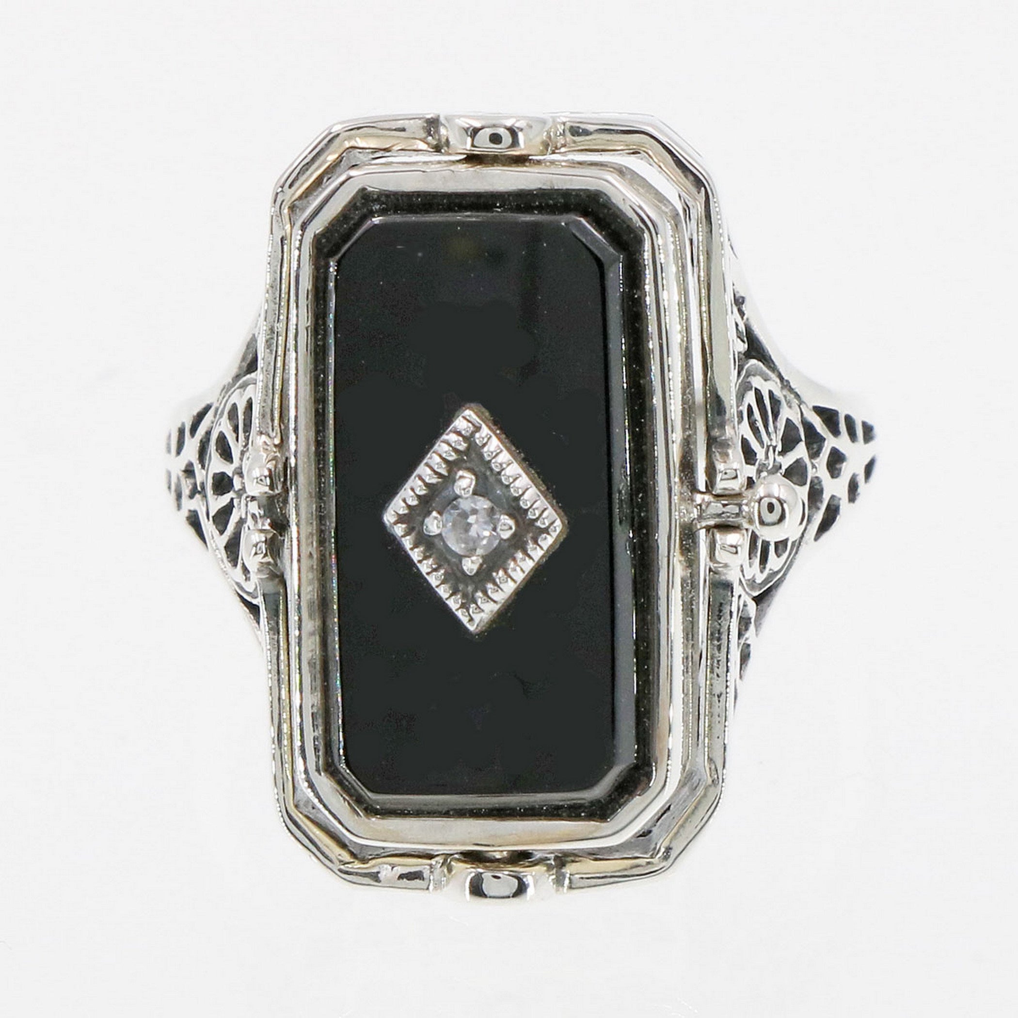 Detail view of Cameo / Onyx w/ Diamonds Filigree Wagon Wheel Flip Ring highlighting Diamond, Onyx