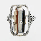 Detail view of Cameo / Onyx w/ Diamonds Filigree Wagon Wheel Flip Ring highlighting Diamond, Onyx