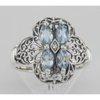 Detail view of Antique Style Four Stone Blue Topaz and Diamond Ring highlighting Blue Topaz, Diamond