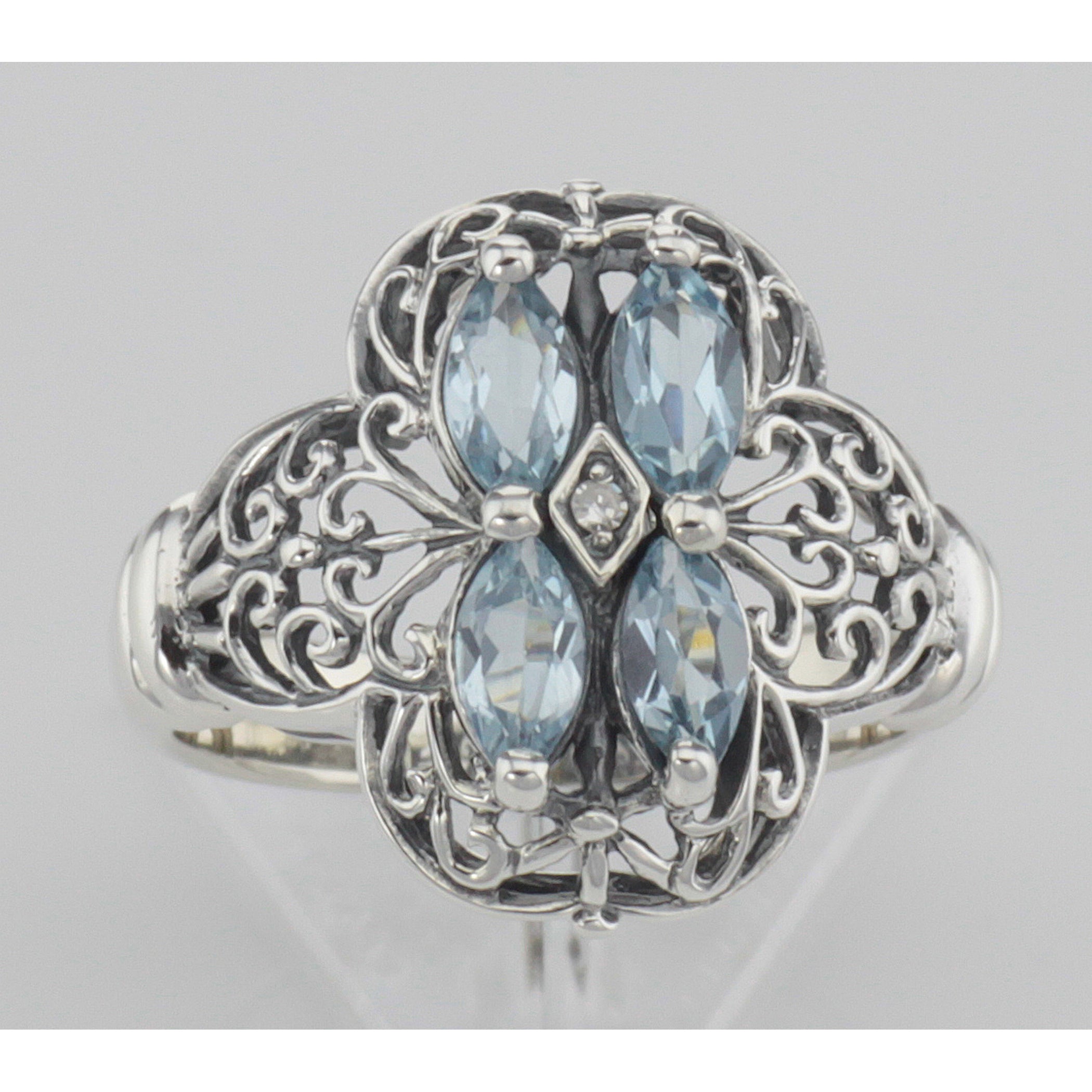 Detail view of Antique Style Four Stone Blue Topaz and Diamond Ring highlighting Blue Topaz, Diamond