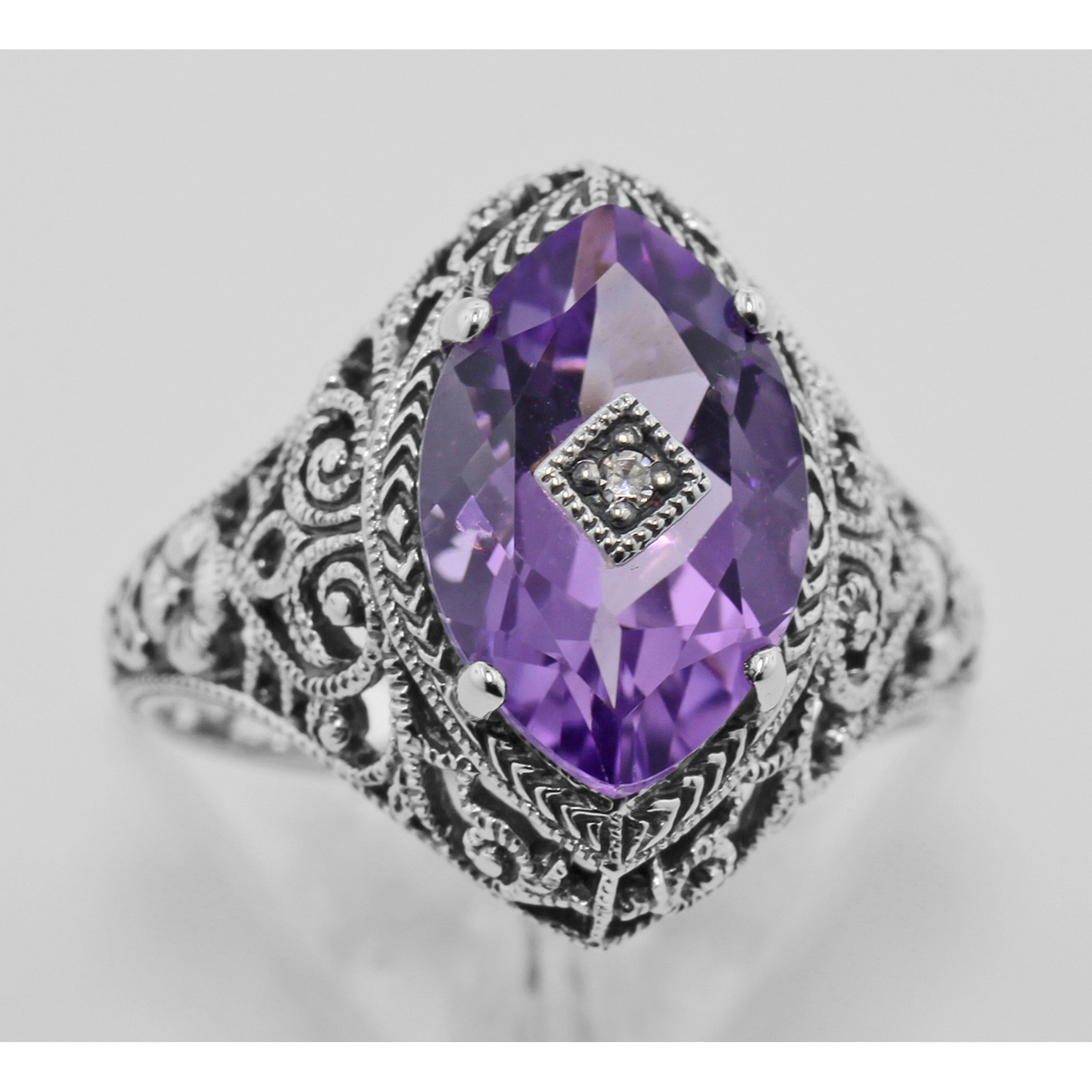 Detail view of Victorian Style Sterling Silver Amethyst Filigree Ring w/ Diamond Center highlighting Amethyst, Diamond