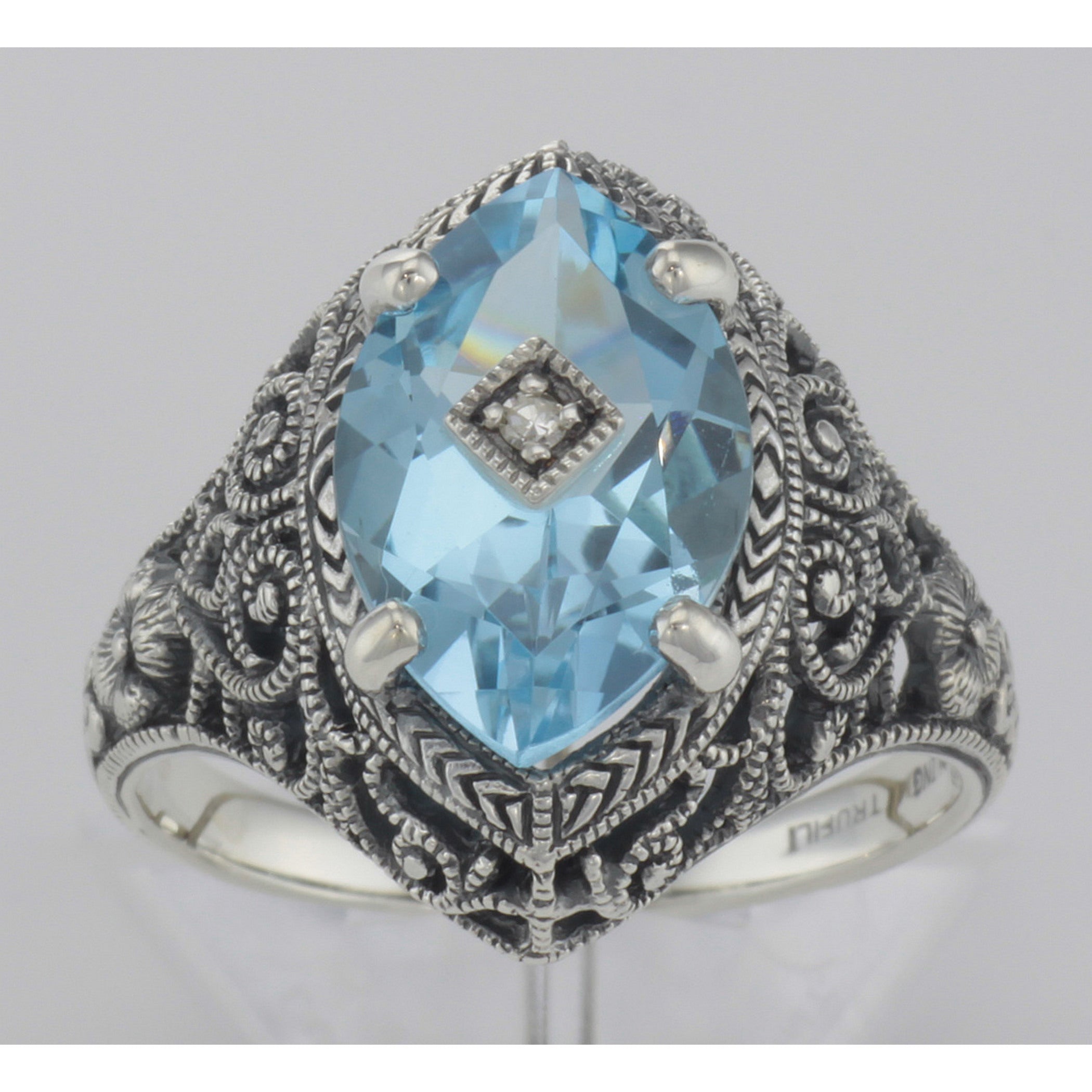 Detail view of Victorian Style Sterling Silver Blue Topaz Filigree Ring w/ Diamond Center highlighting Blue Topaz, Diamond