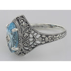 Back view of Victorian Style Sterling Silver Blue Topaz Filigree Ring w/ Diamond Center showing 925 sterling silver hallmark