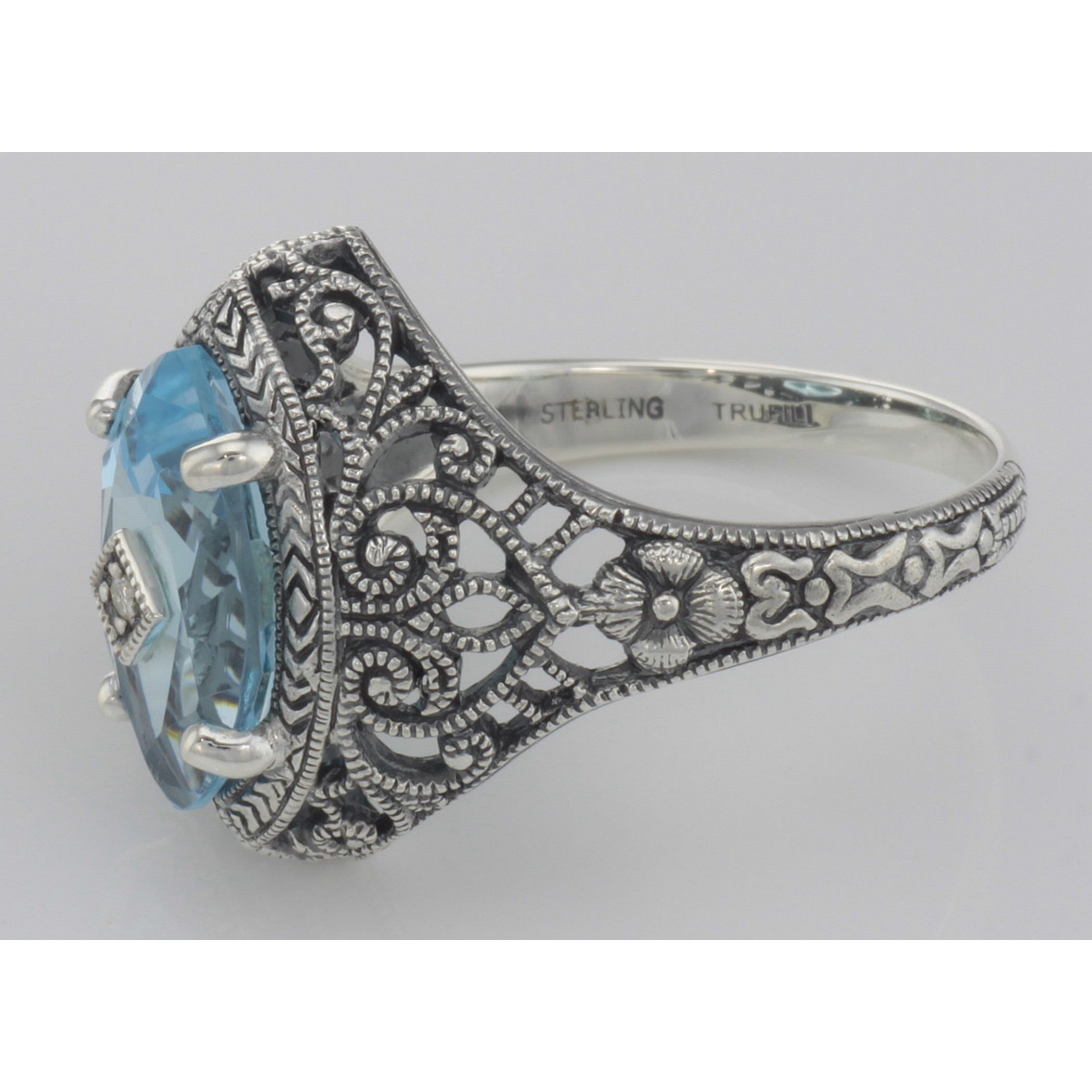 Back view of Victorian Style Sterling Silver Blue Topaz Filigree Ring w/ Diamond Center showing 925 sterling silver hallmark