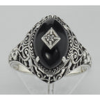 Detail view of Art Deco Style Black Oynx Ring with Diamond Center highlighting Diamond