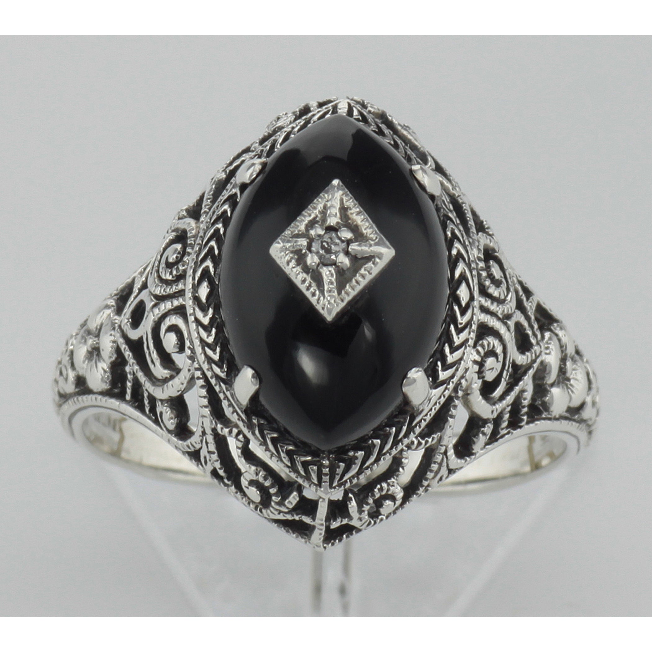 Detail view of Art Deco Style Black Oynx Ring with Diamond Center highlighting Diamond