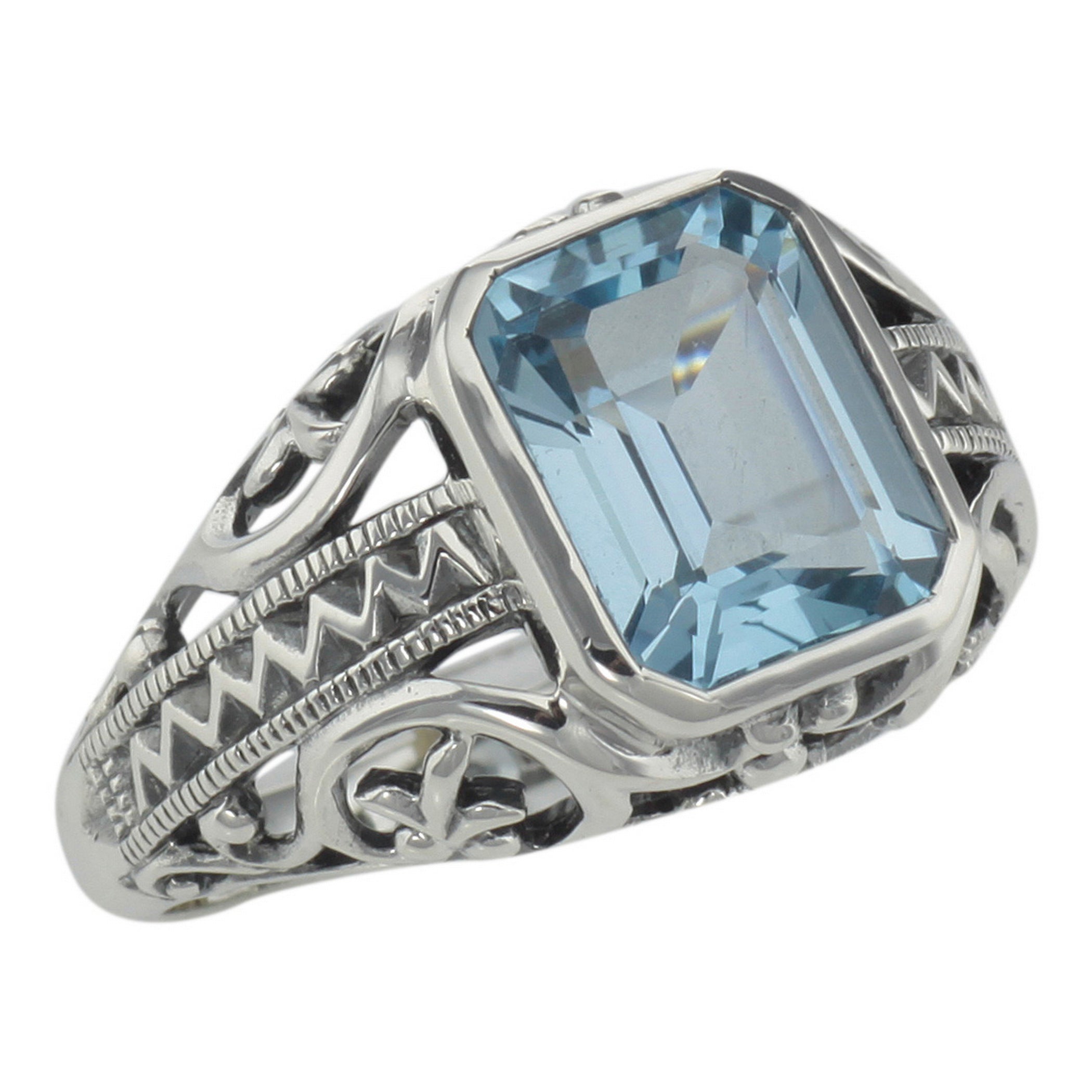Filigree, Blue Topaz, Emerald, sterling silver rings, front view