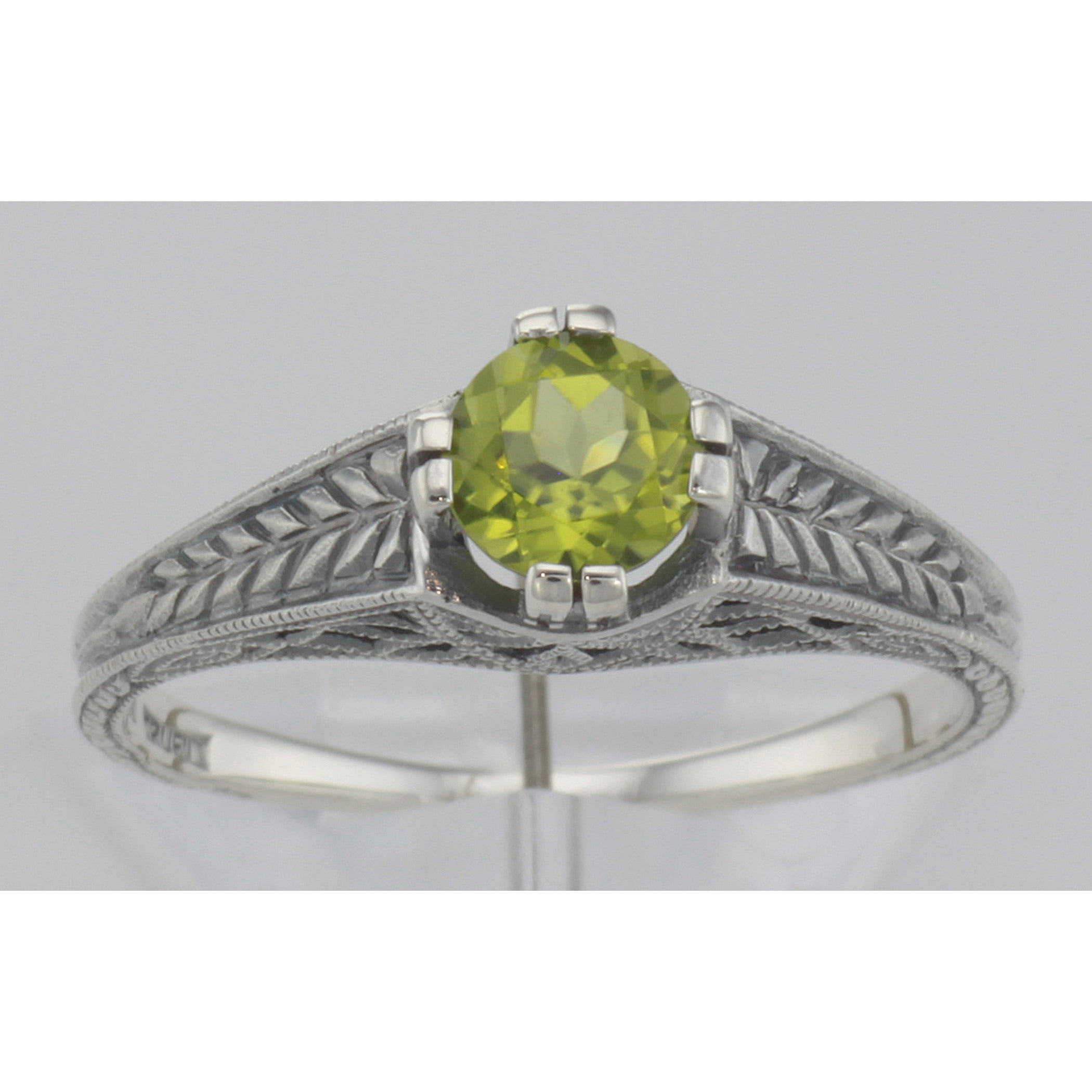 Detail view of Beautiful Victorian Style Peridot Solitaire Filigree Ring Sterling Silver highlighting Peridot