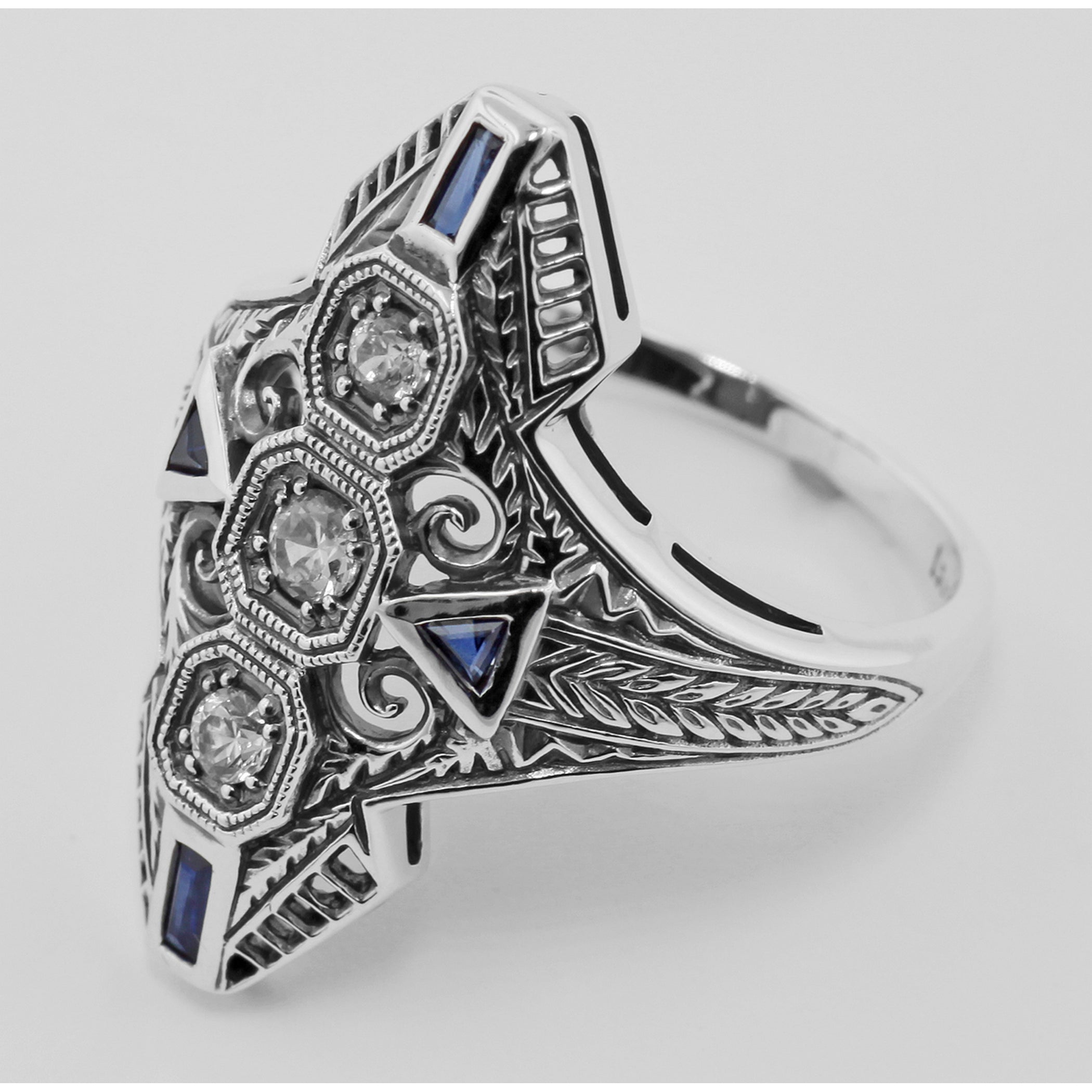 Back view of Art Deco Filigree Ring White Topaz Blue Sapphire Accent Sterling Silver showing 925 sterling silver hallmark