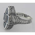 Back view of Antique Style Four Stone Blue Topaz and Diamond Ring showing 925 sterling silver hallmark