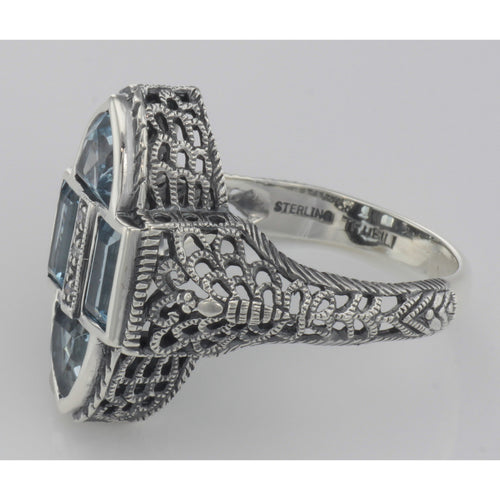 Back view of Antique Style Four Stone Blue Topaz and Diamond Ring showing 925 sterling silver hallmark