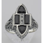 Detail view of Antique Style Four Stone Black Spinel and Diamond Ring highlighting Diamond