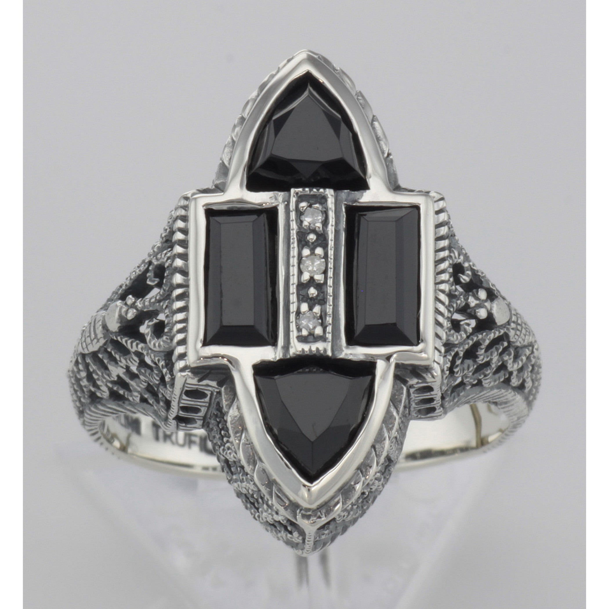 Detail view of Antique Style Four Stone Black Spinel and Diamond Ring highlighting Diamond