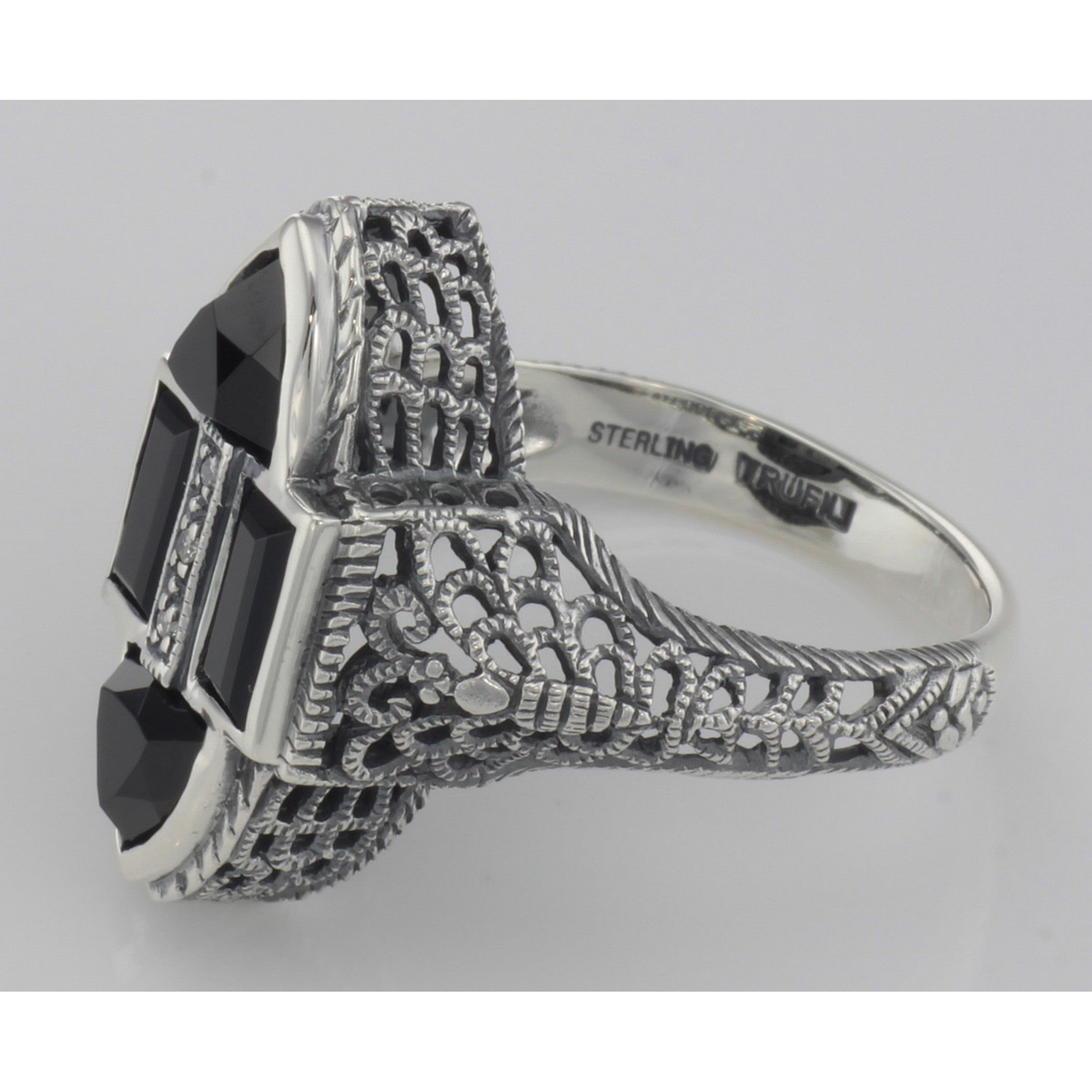 Back view of Antique Style Four Stone Black Spinel and Diamond Ring showing 925 sterling silver hallmark and pin back