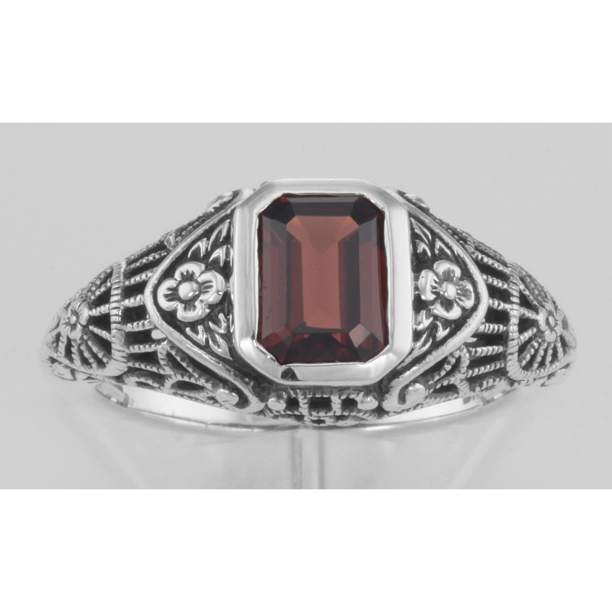 Detail view of Victorian Style Garnet Filigree Ring with Floral Design highlighting Garnet