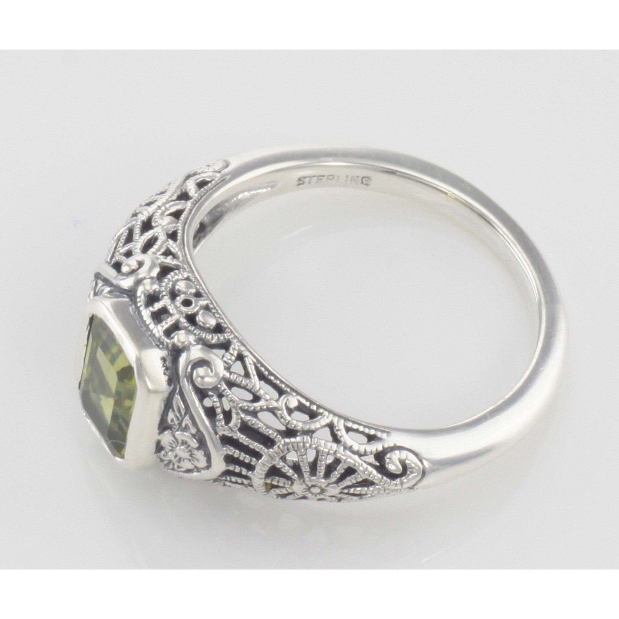 Detail view of Victorian Style Peridot Filigree Ring with Floral Design highlighting Peridot