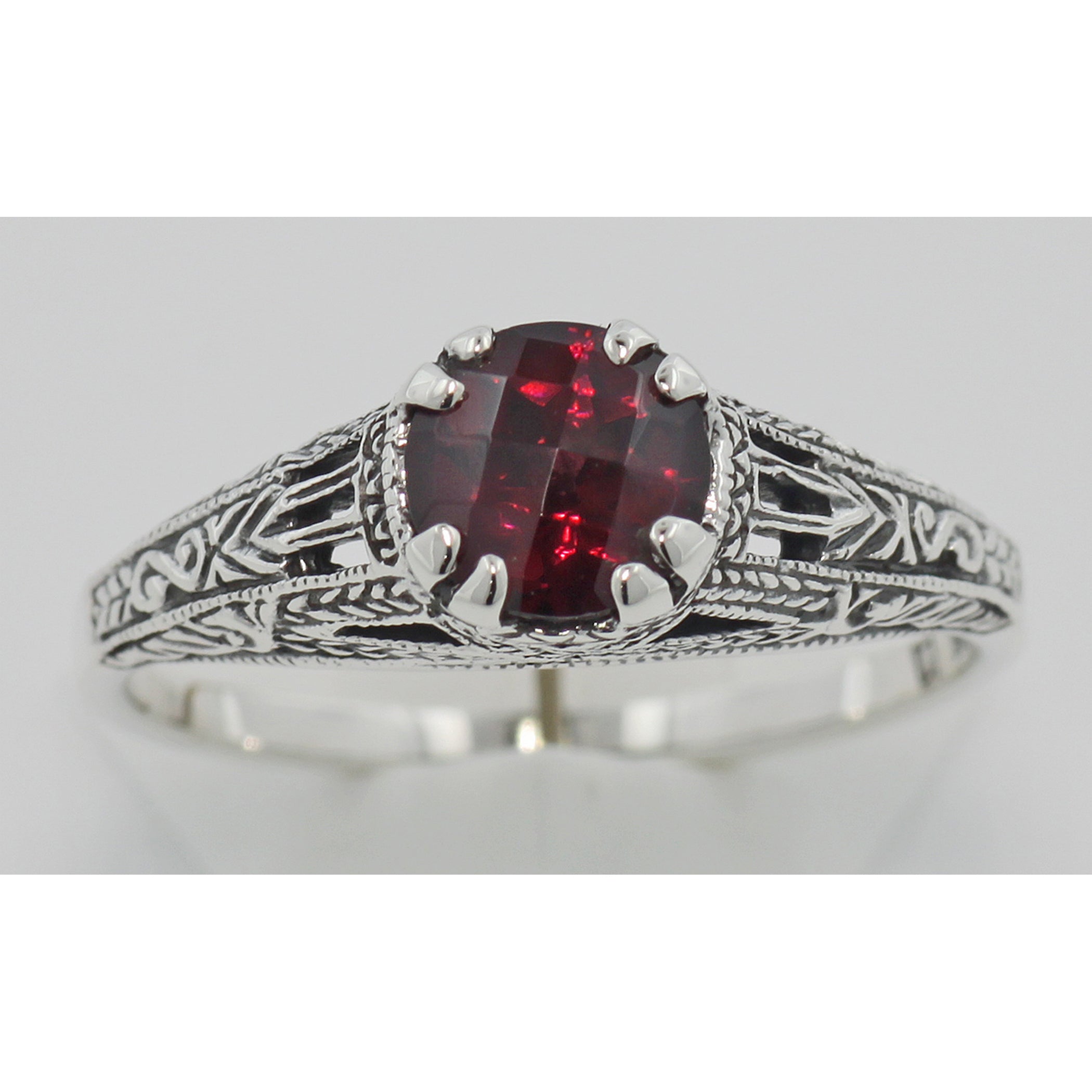 Detail view of Antique Style Red Garnet Filigree Solitaire Ring highlighting Garnet