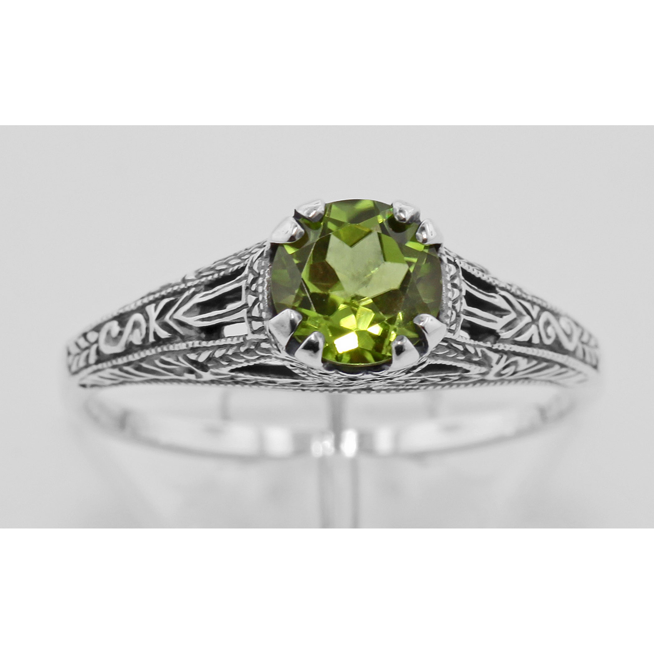 Detail view of Antique Style Green Peridot Filigree Solitaire Ring highlighting Peridot