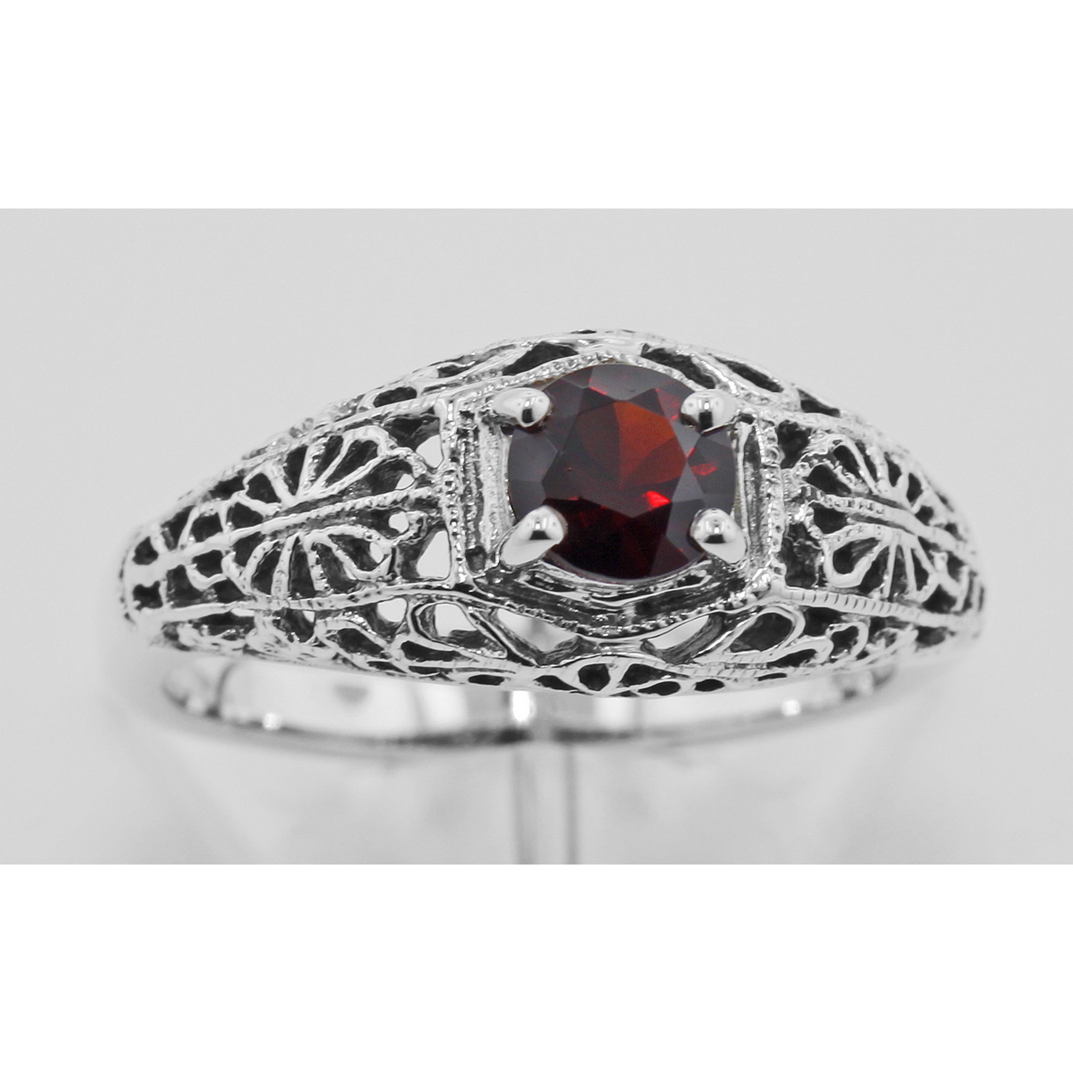 Detail view of Victorian Style Red Garnet Filigree Ring highlighting Garnet