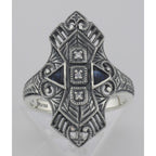 Detail view of Art Deco Style Filigree Ring w/ Sapphires / 3 CZ's highlighting Sapphire, CZ