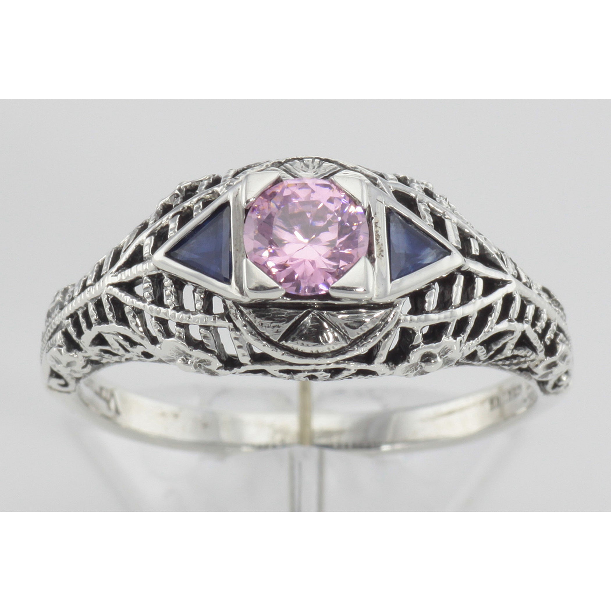 Detail view of Art Deco Style Pink CZ Filigree Ring with Sapphire Accents Sterling Silver highlighting Sapphire, CZ
