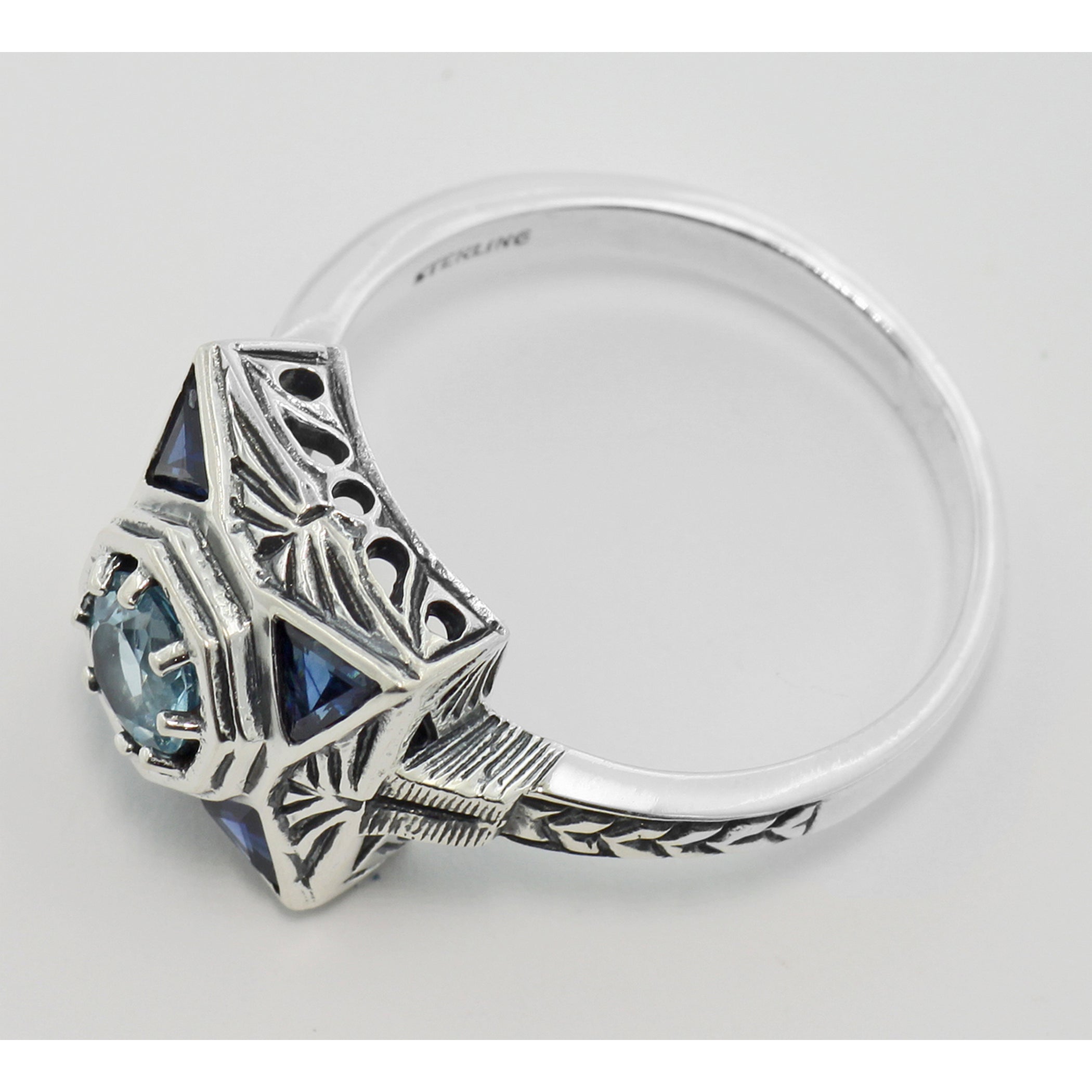 Back view of Art Deco Style Blue Topaz Filigree Ring w/ Sapphire showing 925 sterling silver hallmark