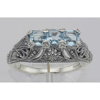 Detail view of Art Deco Sterling Silver Filigree Ring 3 Princess Cut Blue Topaz Gems highlighting Blue Topaz