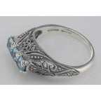 Back view of Art Deco Sterling Silver Filigree Ring 3 Princess Cut Blue Topaz Gems showing 925 sterling silver hallmark