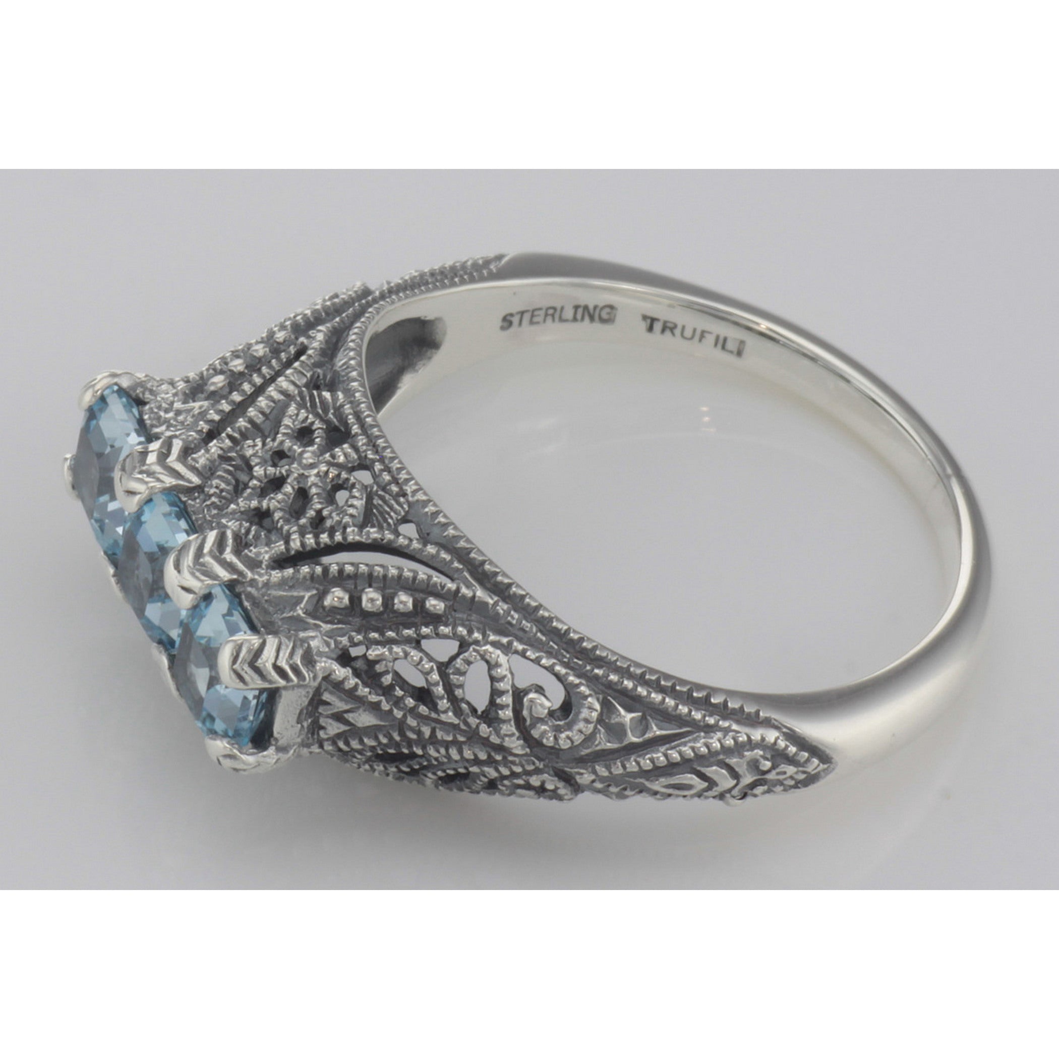 Back view of Art Deco Sterling Silver Filigree Ring 3 Princess Cut Blue Topaz Gems showing 925 sterling silver hallmark