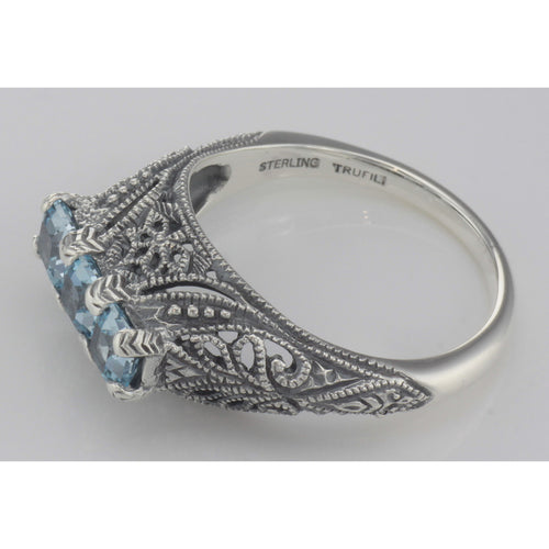 Back view of Art Deco Sterling Silver Filigree Ring 3 Princess Cut Blue Topaz Gems showing 925 sterling silver hallmark