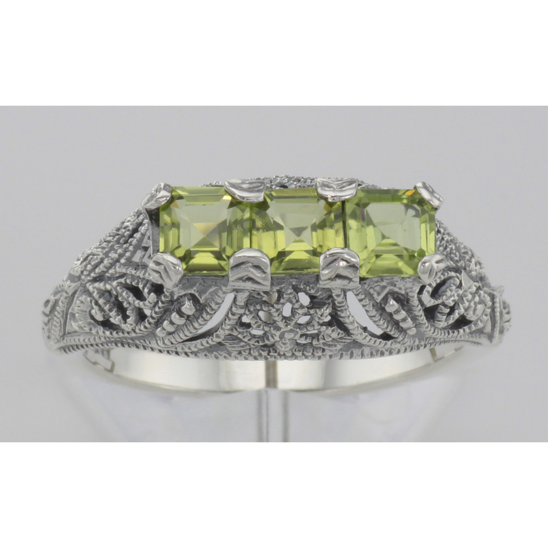 Detail view of Art Deco Style Sterling Silver Filigree Ring 3 Princess Cut Peridot Gems highlighting Peridot
