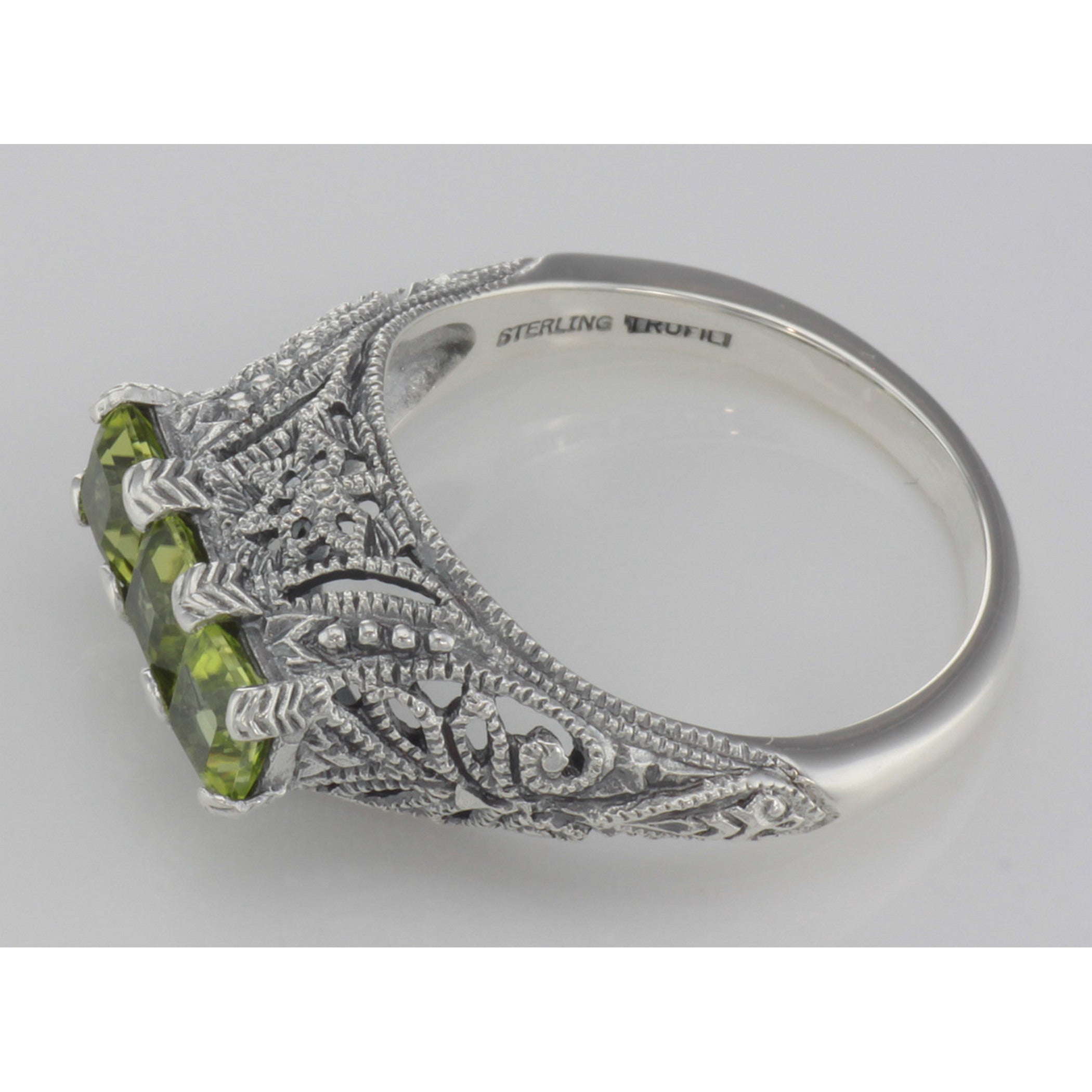 Back view of Art Deco Style Sterling Silver Filigree Ring 3 Princess Cut Peridot Gems showing 925 sterling silver hallmark