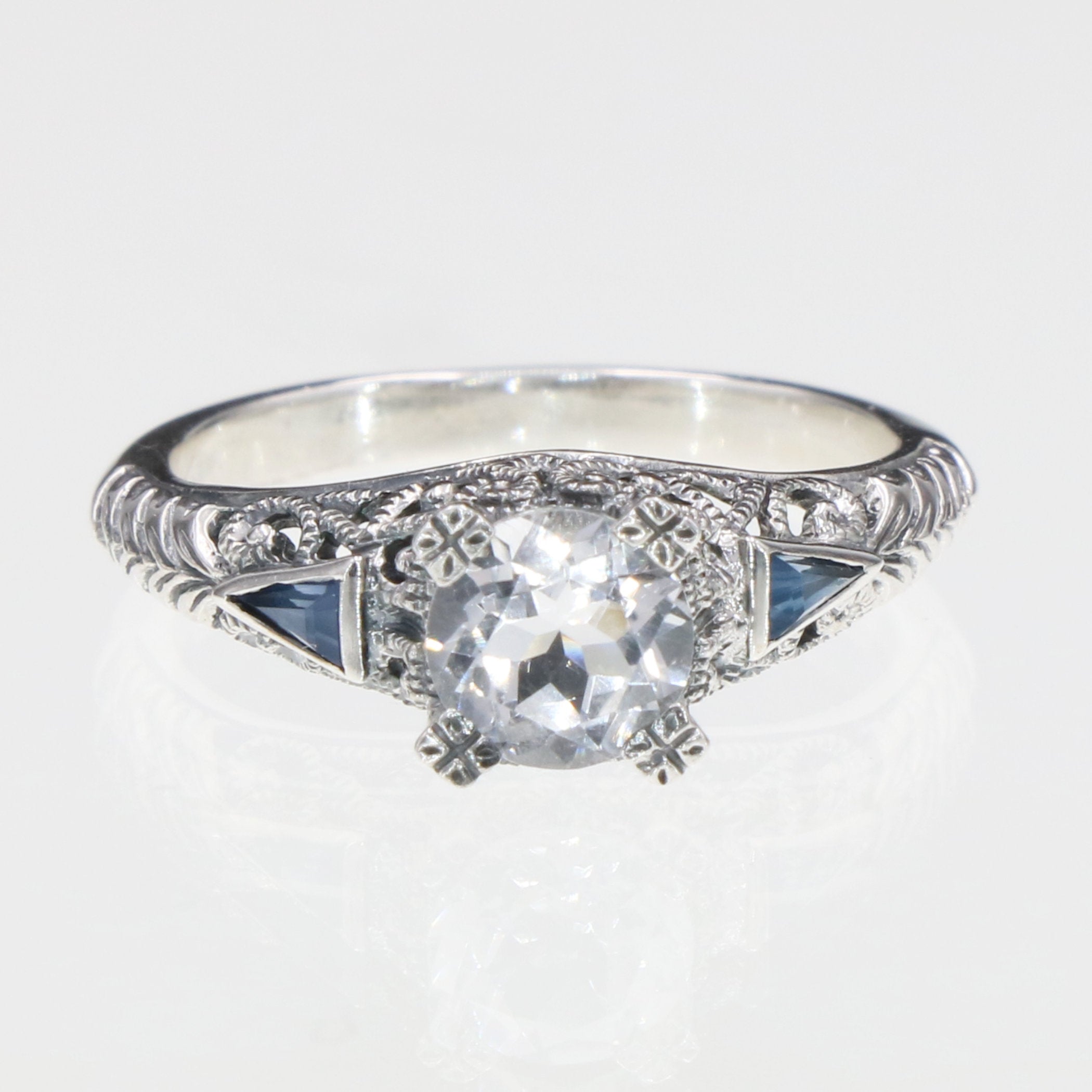 Detail view of Art Deco Filigree Ring w/ White Topaz and Blue Sapphires highlighting White Topaz, Sapphire
