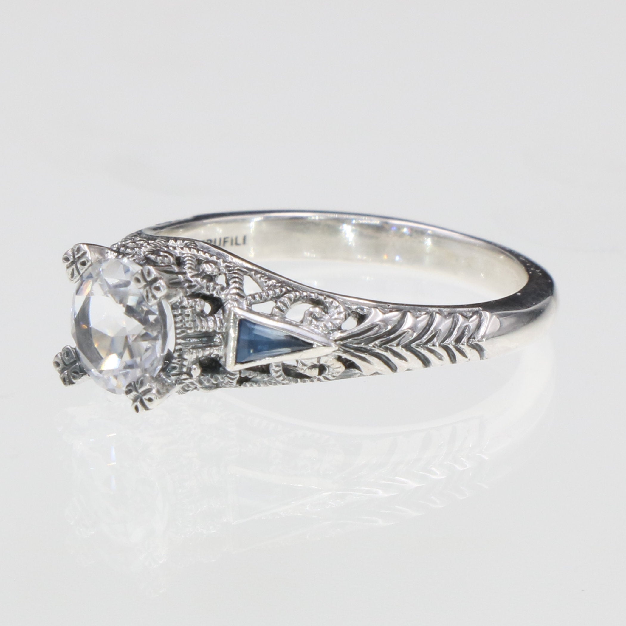 Detail view of Art Deco Filigree Ring w/ White Topaz and Blue Sapphires highlighting White Topaz, Sapphire
