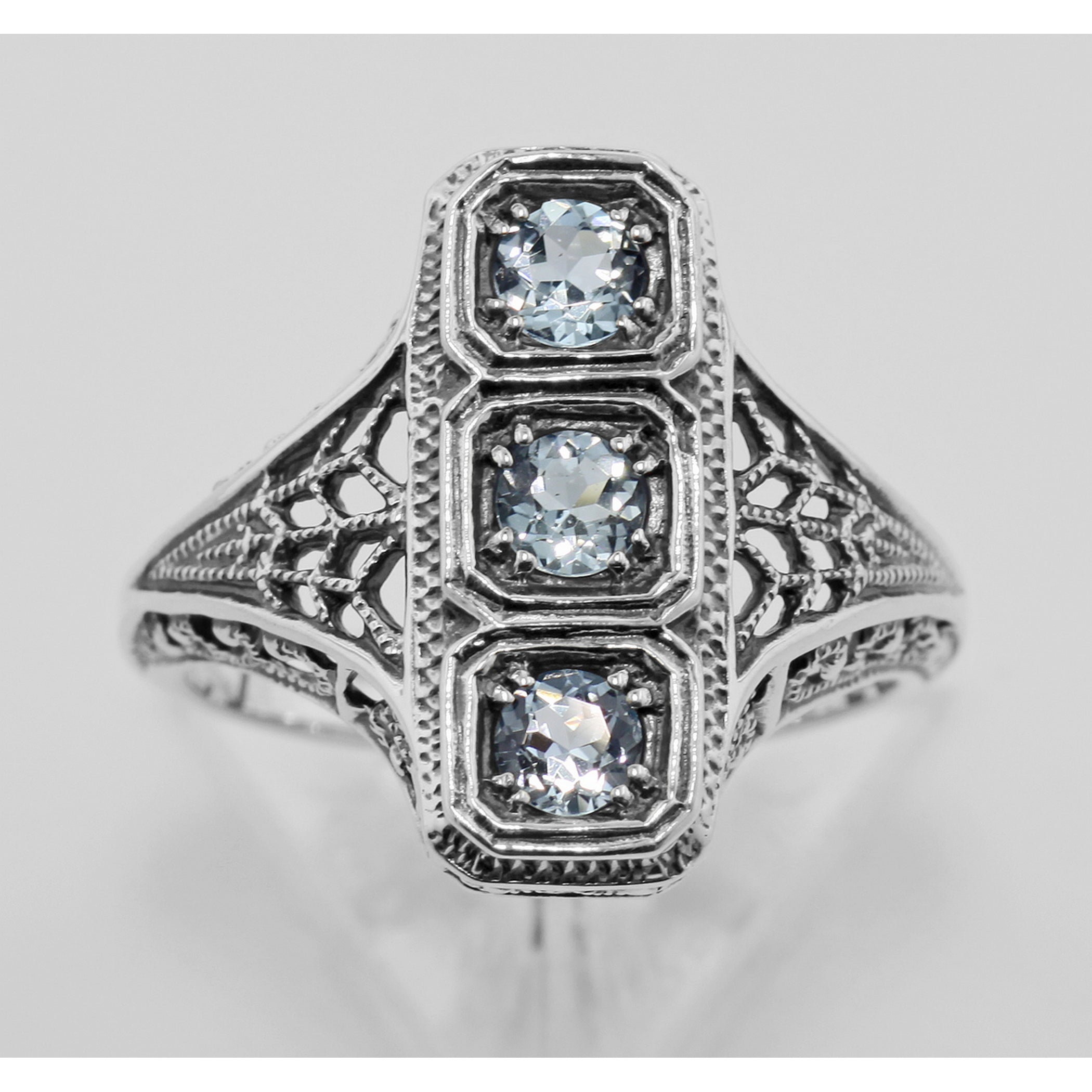 Back view of 3 Stone Blue Topaz Filigree Ring showing 925 sterling silver hallmark