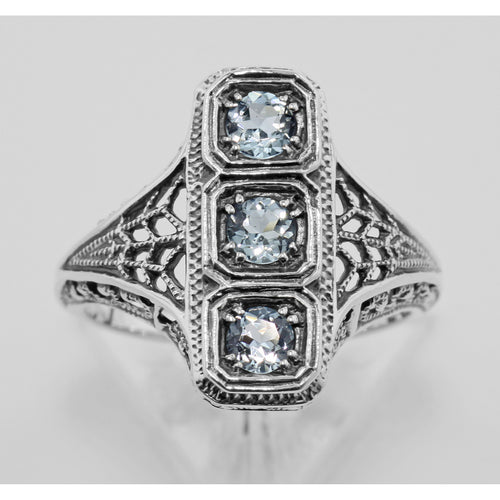 Back view of 3 Stone Blue Topaz Filigree Ring showing 925 sterling silver hallmark