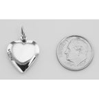 Back view of Antique Border Design Heart Charm or Pendant showing 925 sterling silver hallmark and spring ring clasp
