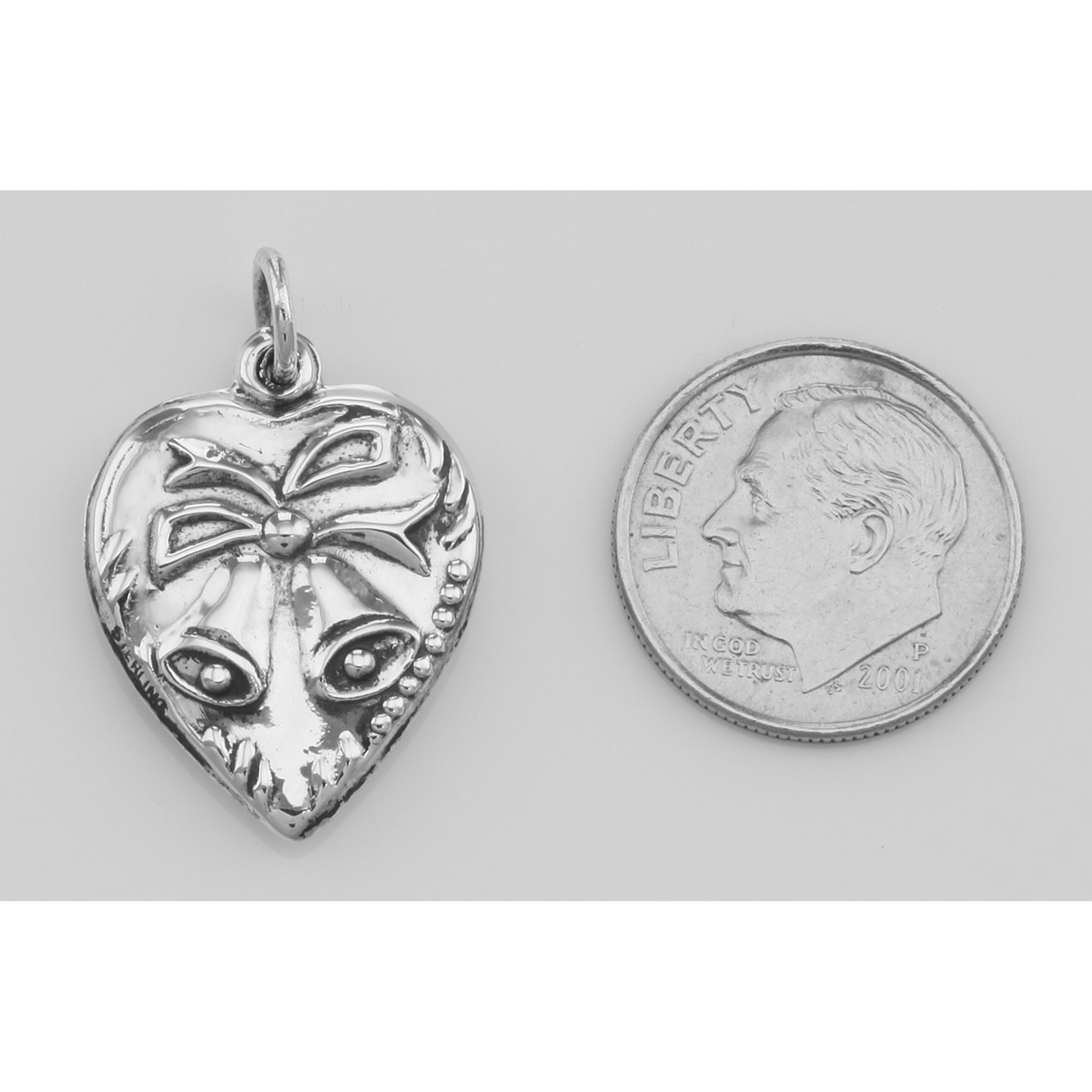 Back view of Heart Pendant Charm with Bells showing 925 sterling silver hallmark and spring ring clasp